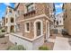 Exterior elevation of a three-story building with stone cladding and arches at 1727 E Chelsea Ln, Gilbert, AZ 85295