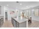 Bright kitchen features granite countertops, stainless steel appliances, and a breakfast bar with modern seating at 1727 E Chelsea Ln, Gilbert, AZ 85295