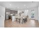 Modern kitchen featuring an island with seating, grey cabinetry, and stainless steel appliances for a sleek design at 1727 E Chelsea Ln, Gilbert, AZ 85295