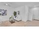 Bright living room with white walls, neutral carpet, ceiling fan, and a modern sofa set at 1727 E Chelsea Ln, Gilbert, AZ 85295