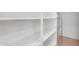 Walk-in pantry offers ample storage with built-in shelving and chrome storage racks at 1727 E Chelsea Ln, Gilbert, AZ 85295