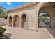 Pool house with arched doorway, shower and bathroom at 1727 E Chelsea Ln, Gilbert, AZ 85295