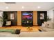 Modern living room features sleek accent wall and neutral tones, creating a stylish and comfortable space at 1831 E Cornell Dr, Tempe, AZ 85283