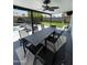 Covered patio with ample seating, ceiling fan, and backyard views, great for entertaining at 1831 E Cornell Dr, Tempe, AZ 85283