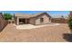 View of house from backyard with gravel and walking path at 2191 W Goldmine Mountain Dr, Queen Creek, AZ 85144