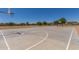 Outdoor basketball court perfect for Gathering fun, with community homes pictured in the background at 2191 W Goldmine Mountain Dr, Queen Creek, AZ 85144