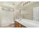 Bathroom with tile flooring, single sink vanity and tub with shower at 2191 W Goldmine Mountain Dr, Queen Creek, AZ 85144