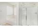 Bright bathroom featuring a separate shower and soaking tub and natural light at 2191 W Goldmine Mountain Dr, Queen Creek, AZ 85144