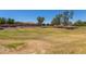 Expansive grassy area in the community park at 2191 W Goldmine Mountain Dr, Queen Creek, AZ 85144
