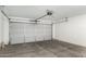 Clean garage featuring a large door at 2191 W Goldmine Mountain Dr, Queen Creek, AZ 85144