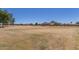 Expansive open field, perfect for recreation and outdoor activities, with mountain views in the distance at 2191 W Goldmine Mountain Dr, Queen Creek, AZ 85144