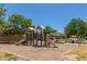 Community playground with slides and climbing structure at 2191 W Goldmine Mountain Dr, Queen Creek, AZ 85144