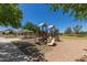 Well-maintained playground area with covered picnic tables at 2191 W Goldmine Mountain Dr, Queen Creek, AZ 85144