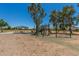 Community playground with slides, climbing structure and covered picnic tables at 2191 W Goldmine Mountain Dr, Queen Creek, AZ 85144