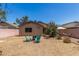 Gravel backyard featuring a home's rear, outdoor seating, landscaping, and fence at 22056 N 32Nd Ave, Phoenix, AZ 85027