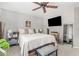Cozy bedroom with a ceiling fan, a comfortable bed, and a mounted TV at 22056 N 32Nd Ave, Phoenix, AZ 85027