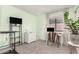 Bedroom with a light green accent wall, and a desk in front of the window at 22056 N 32Nd Ave, Phoenix, AZ 85027