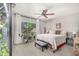 Relaxing bedroom featuring a ceiling fan, a comfortable bed, and natural lighting at 22056 N 32Nd Ave, Phoenix, AZ 85027