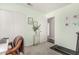 Bedroom with neutral green walls and white trim, featuring a plant and decorative prints at 22056 N 32Nd Ave, Phoenix, AZ 85027