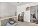 Bedroom featuring a cabinet, houseplant, and a doorway that leads to another room at 22056 N 32Nd Ave, Phoenix, AZ 85027
