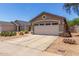 A single story house with a two car garage and desert landscaping out front at 22056 N 32Nd Ave, Phoenix, AZ 85027