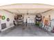 Spacious garage featuring a utility sink, washing machine, shelves, and a refrigerator at 22056 N 32Nd Ave, Phoenix, AZ 85027