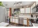 Well-lit kitchen with stainless steel appliances, white countertops, and a view to the backyard at 22056 N 32Nd Ave, Phoenix, AZ 85027