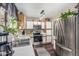 Bright kitchen with stainless steel appliances, white cabinets, and modern lighting fixtures at 22056 N 32Nd Ave, Phoenix, AZ 85027