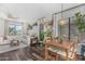 Bright living room area with hardwood floors, a large window, and a comfortable couch at 22056 N 32Nd Ave, Phoenix, AZ 85027