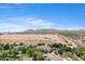 Stunning aerial perspective of a luxury community surrounded by desert landscape and mountains at 24434 S 201St Ct, Queen Creek, AZ 85142