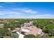 Luxury home with private pool, covered patios, and verdant landscaping viewed from above at 24434 S 201St Ct, Queen Creek, AZ 85142