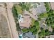 Overhead view of the property featuring a stunning pool, guest house, and well-manicured landscape at 24434 S 201St Ct, Queen Creek, AZ 85142