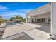 Resort-style backyard featuring a large pool, covered patio, and lush landscaping at 24434 S 201St Ct, Queen Creek, AZ 85142