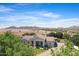 Expansive property showcasing a beautifully landscaped yard and mountain views in a serene setting at 24434 S 201St Ct, Queen Creek, AZ 85142