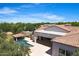 Backyard aerial view highlighting a sparkling pool, cabana, and covered patio area at 24434 S 201St Ct, Queen Creek, AZ 85142