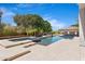 Amazing pool area featuring an attached jacuzzi and an outdoor pavilion with full kitchen amenities at 24434 S 201St Ct, Queen Creek, AZ 85142