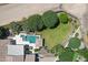 Backyard aerial showcasing a sparkling pool, lush greenery, and serene outdoor living space at 24434 S 201St Ct, Queen Creek, AZ 85142