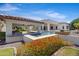 Stunning backyard pool with cabana, spa, and lush landscaping, perfect for outdoor entertaining at 24434 S 201St Ct, Queen Creek, AZ 85142