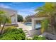 Beautiful pool and spa combination area featuring manicured landscaping, perfect for relaxing by the water at 24434 S 201St Ct, Queen Creek, AZ 85142