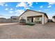 A spacious backyard featuring a covered patio, perfect for outdoor relaxation and entertaining at 25119 N 134Th Dr, Peoria, AZ 85383