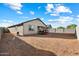 Expansive backyard showcasing ample space and privacy, enclosed by block fencing, ideal for various outdoor activities at 25119 N 134Th Dr, Peoria, AZ 85383