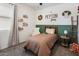 bedroom featuring a twin bed, carpet, and decorative wall art at 25119 N 134Th Dr, Peoria, AZ 85383