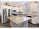 Bright kitchen with granite countertops, stainless steel appliances, and ample white cabinetry at 25119 N 134Th Dr, Peoria, AZ 85383