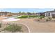 Well-maintained backyard featuring a pool, outdoor seating area, and desert landscaping at 26626 N 70Th Pl, Scottsdale, AZ 85266