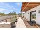 Charming backyard with desert landscaping, stone pathway, and modern architectural details at 26626 N 70Th Pl, Scottsdale, AZ 85266