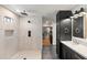 Bathroom features a soaking tub, walk-in shower, and custom vanity leading to closet at 26626 N 70Th Pl, Scottsdale, AZ 85266