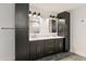 Bathroom featuring double vanities, modern fixtures, soaking tub, and tiled shower at 26626 N 70Th Pl, Scottsdale, AZ 85266