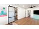Spacious bedroom showcases closet entrance and wood floors plus a bright-colored TV cabinet at 26626 N 70Th Pl, Scottsdale, AZ 85266