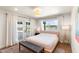 Bright bedroom featuring wood floors, French doors to the back, and desert views at 26626 N 70Th Pl, Scottsdale, AZ 85266