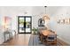 Bright dining room with modern decor, stylish lighting, and views to the front yard at 26626 N 70Th Pl, Scottsdale, AZ 85266